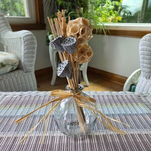 Rustic Dried Floral Arrangement in Round Glass Bottle Vase with Raffia Bow